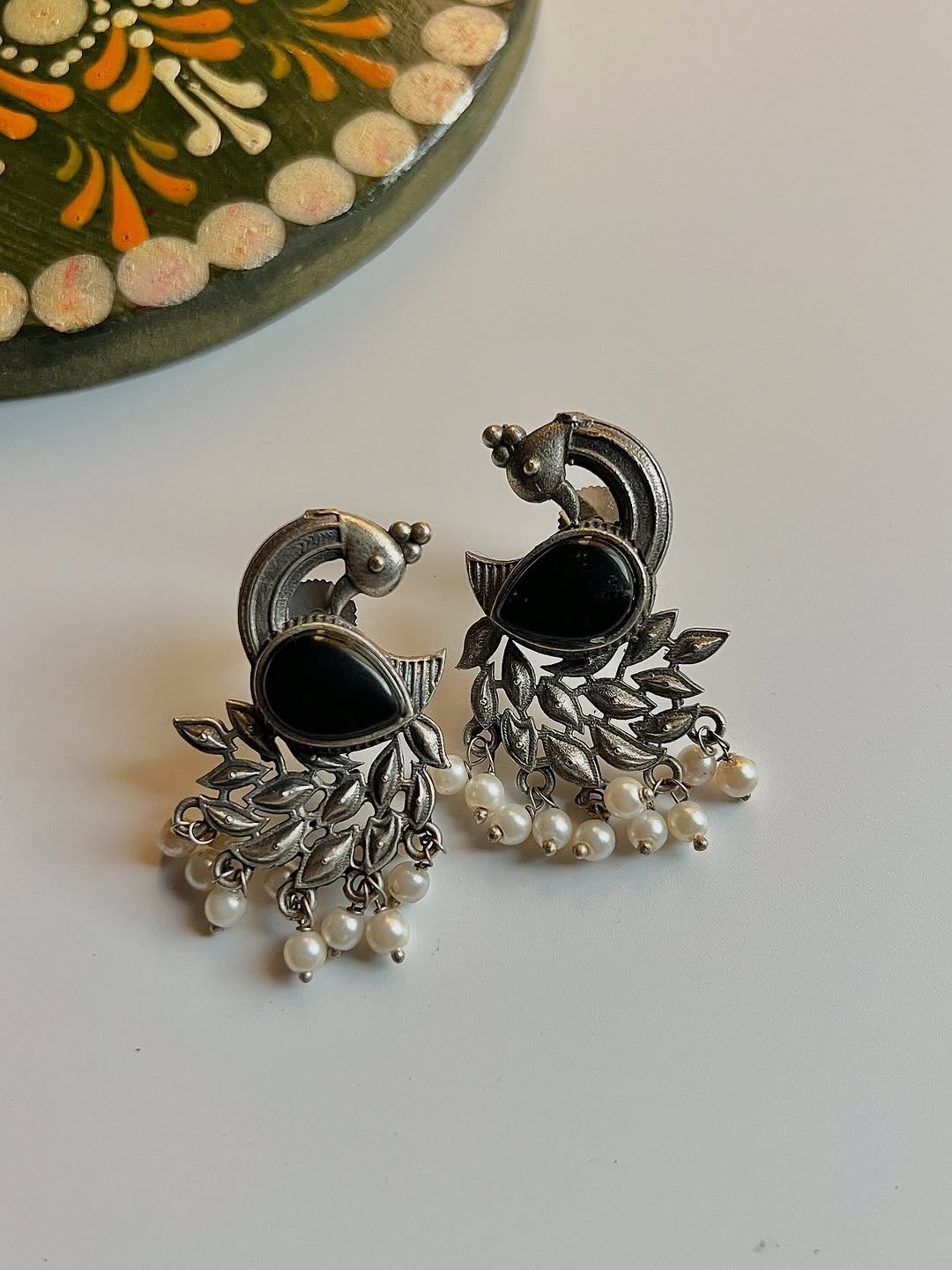 Peacock studs