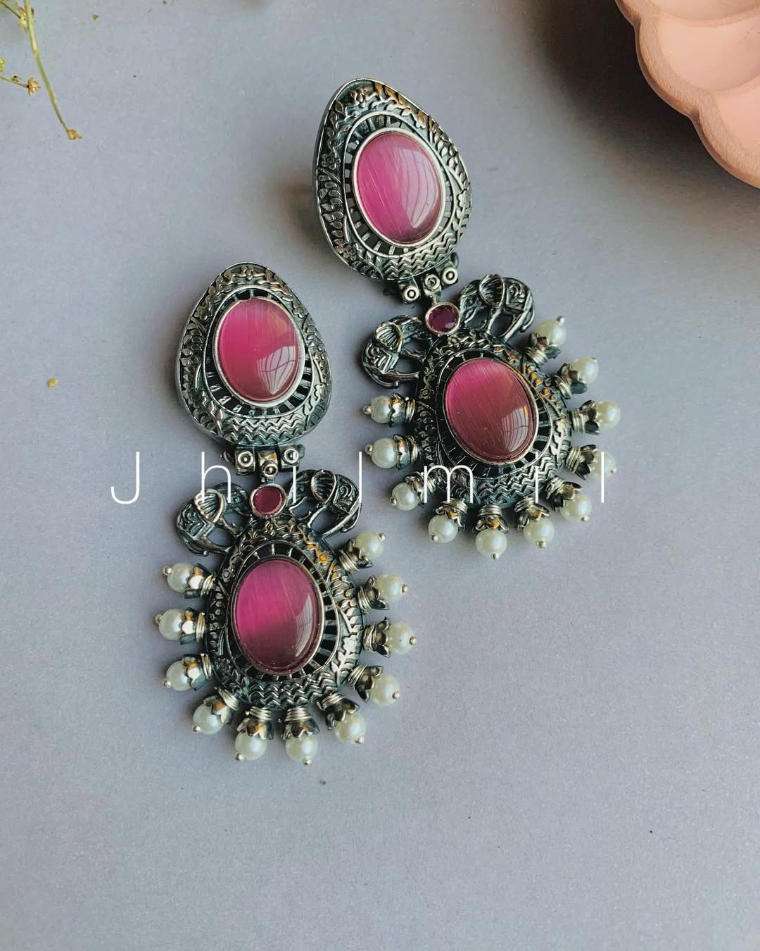 Elephant motif designer look earrings