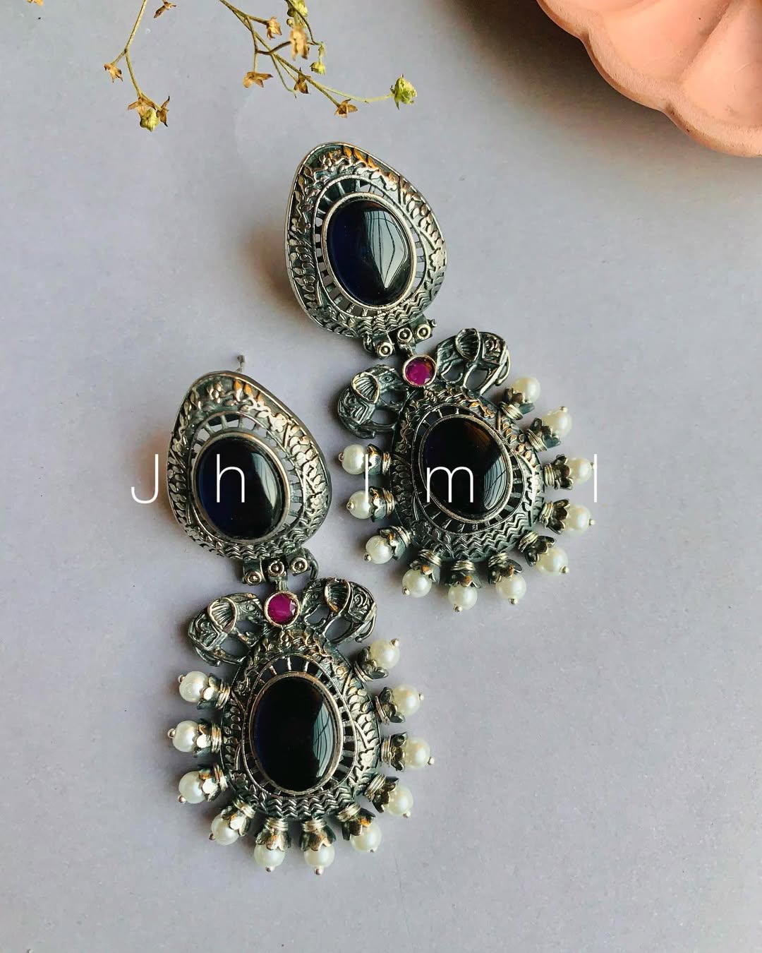 Elephant motif designer look earrings