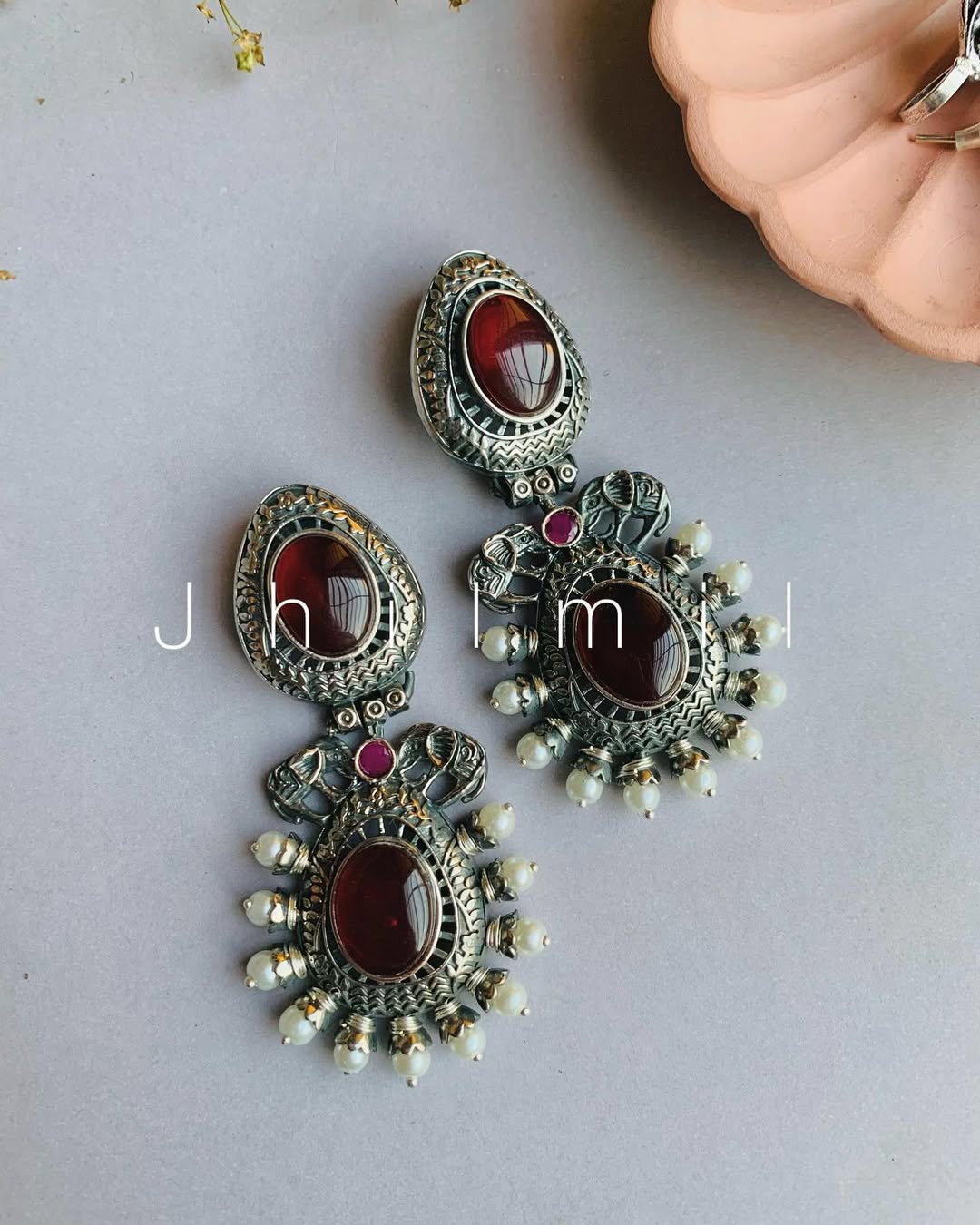 Elephant motif designer look earrings