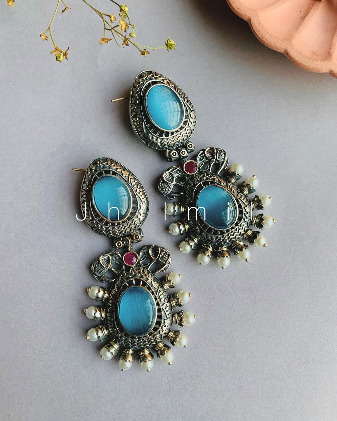 Elephant motif designer look earrings