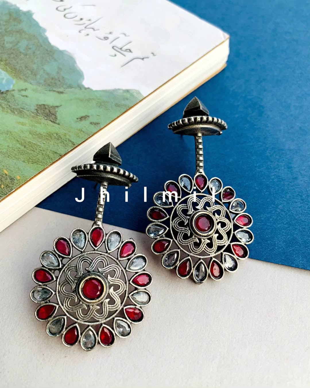 Stone embellished flower drop danglers