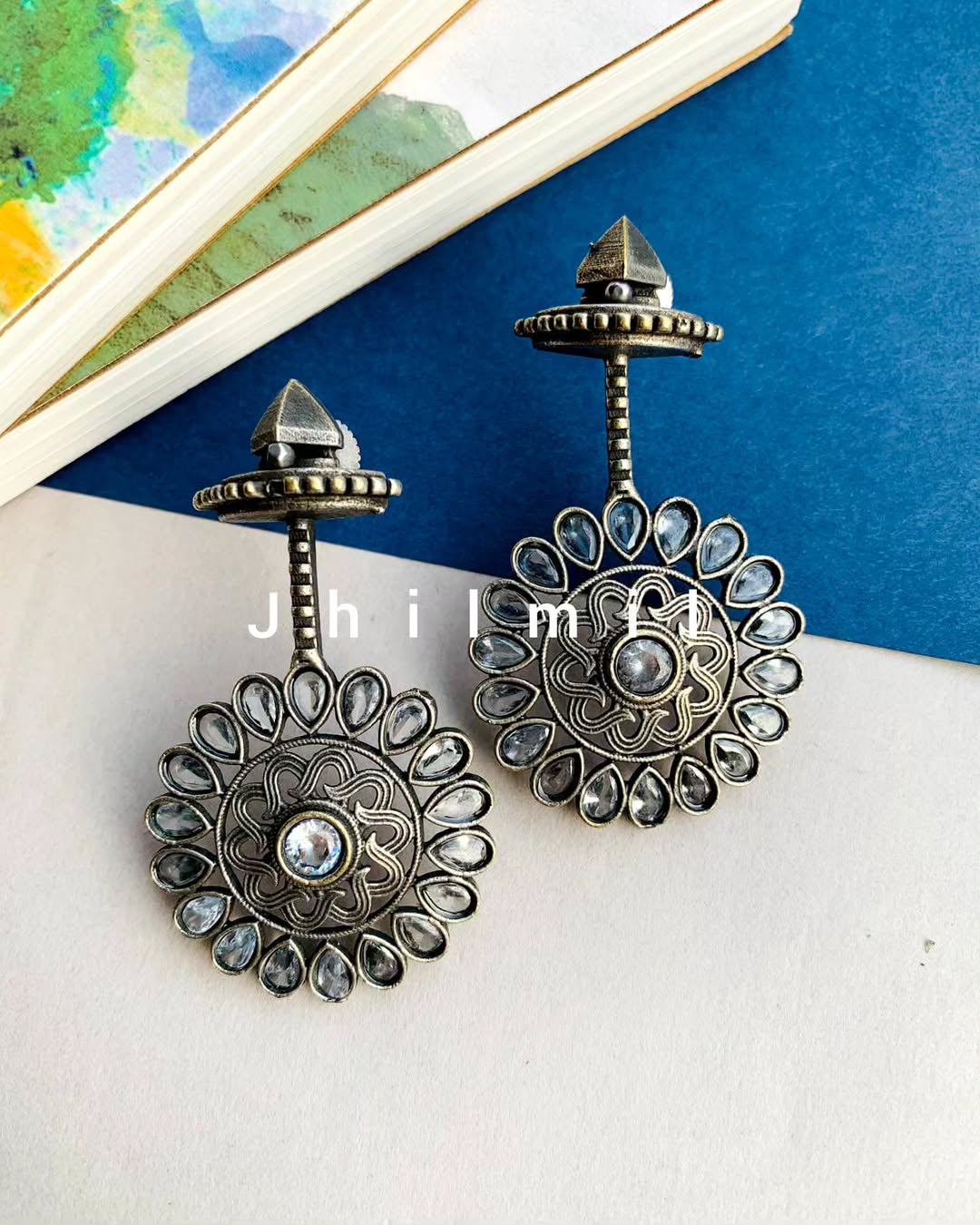 Stone embellished flower drop danglers