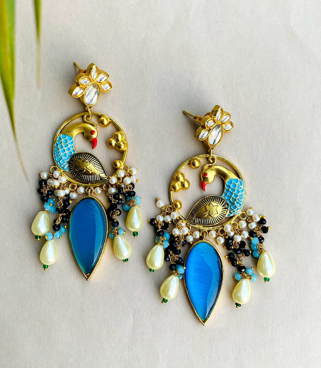 Gold plated kundan peacock earrings