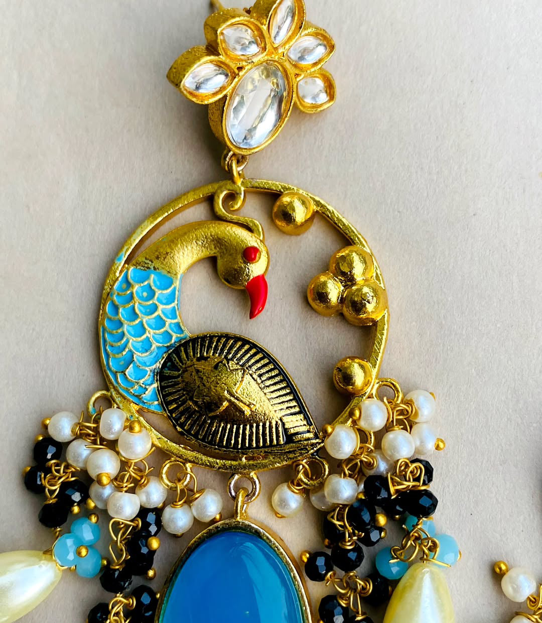 Gold plated kundan peacock earrings