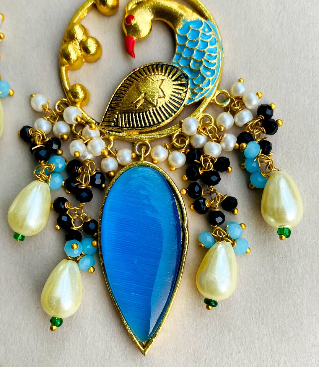 Gold plated kundan peacock earrings