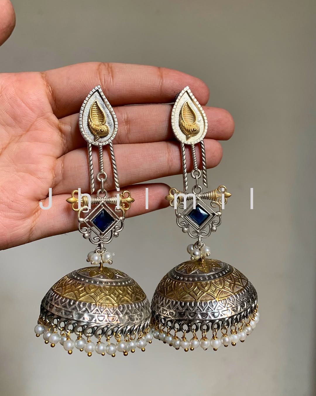 Dazzling oversized dual tone Jhumkas