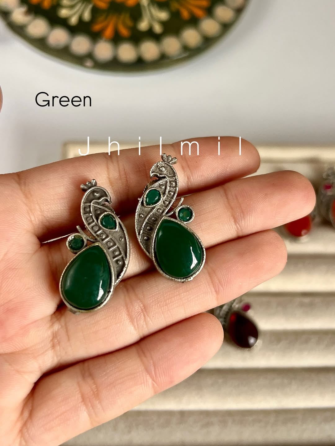 Mini peacock studs