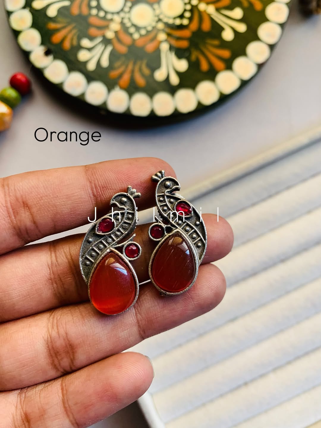 Mini peacock studs