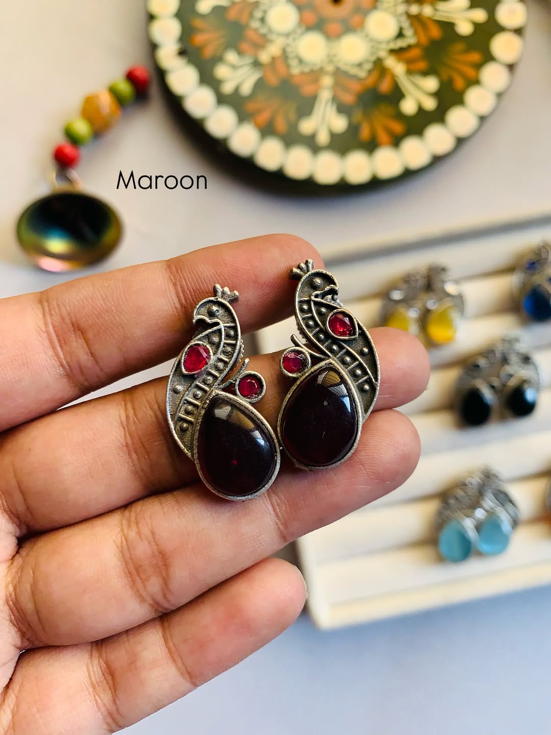 Mini peacock studs